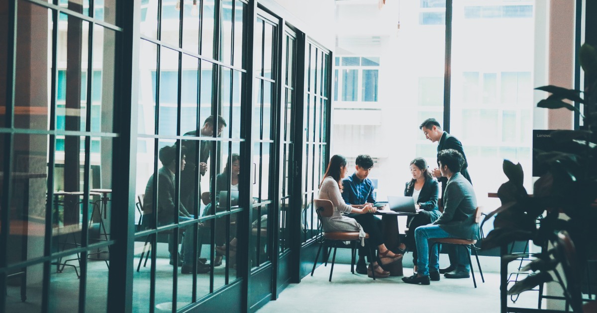 Group of people meeting in a coworking space.